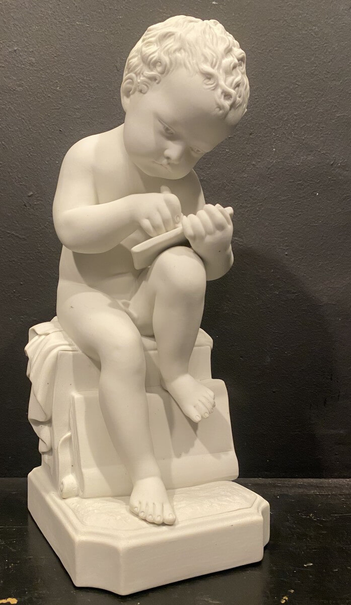 Biscuit, enfant écrivant